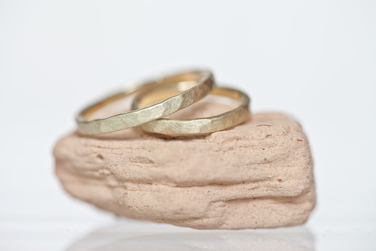 Minimalist Gold Wedding Ring Set – angular, delicately hammered, and timelessly elegant